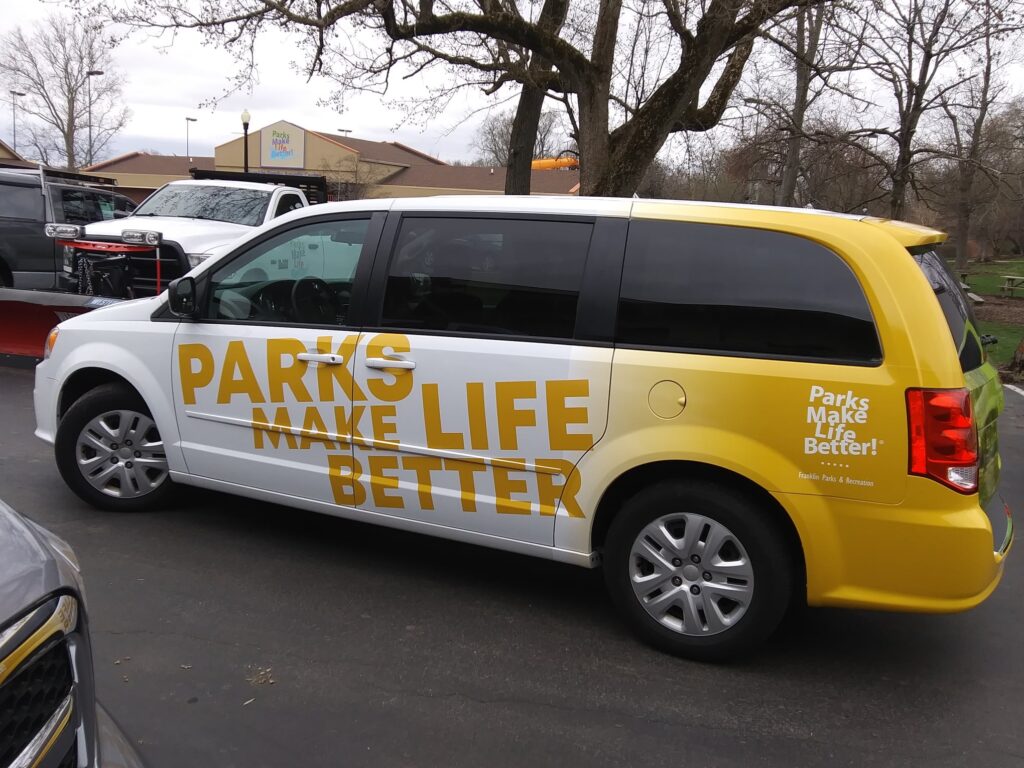 Van with Signature Graphics vinyl wrap