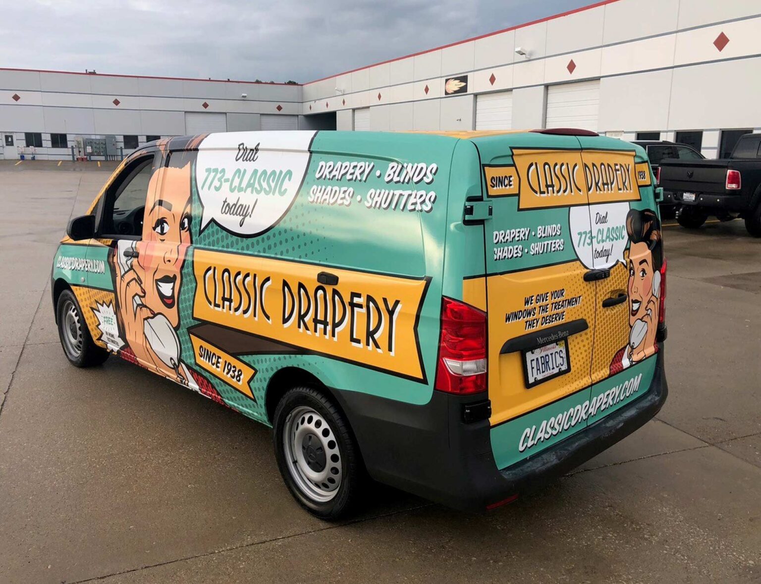 van with teal and yellow graphics on it for a drapery business