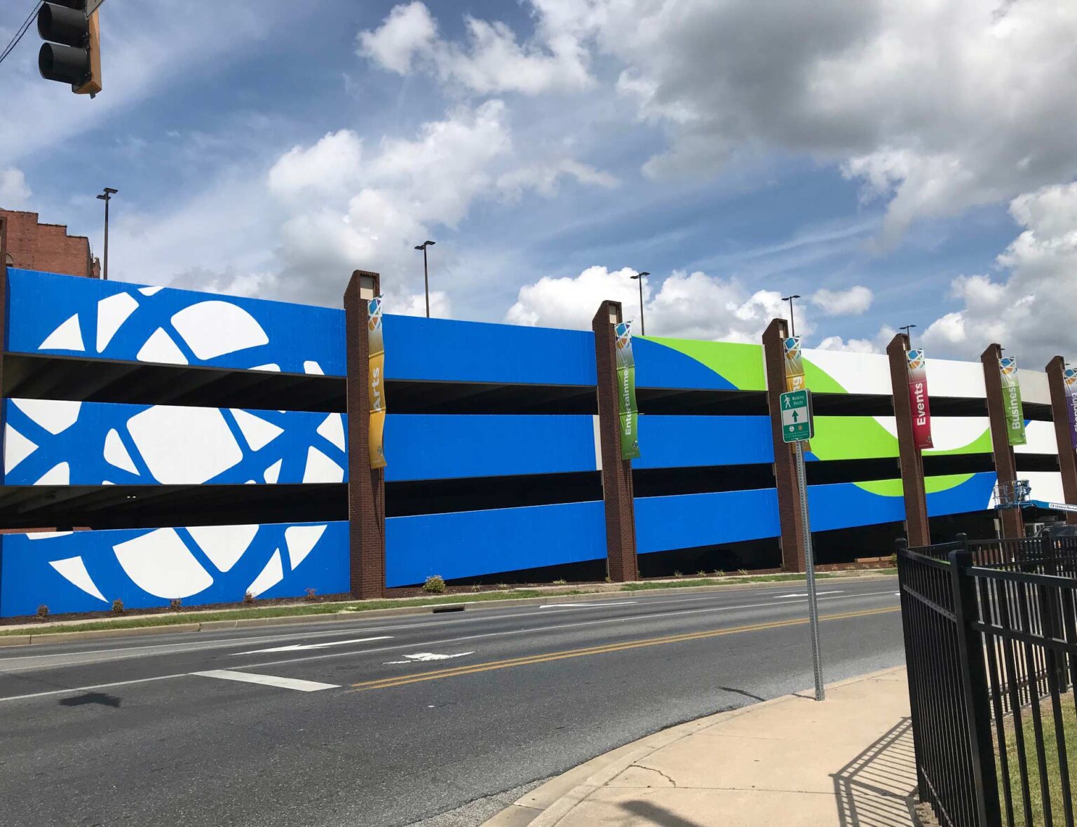 parking garage with environmental wrap that's blue white and green