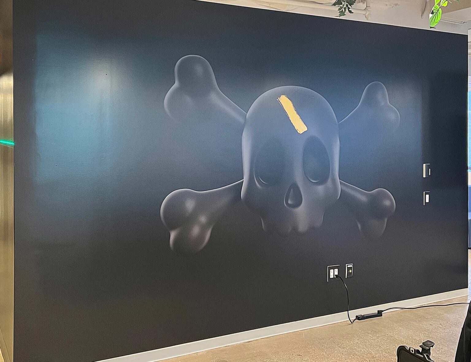 wall graphic with a skull for TBWA office in New York